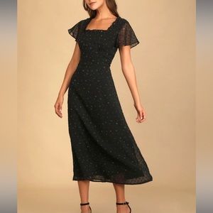 Lulu’s black Swiss dot midi dress with flutter sleeves